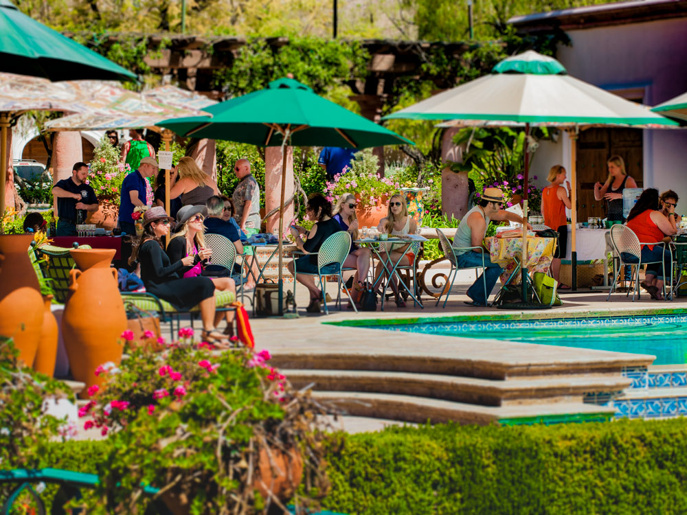 Visitors enjoying outdoor wine tastings at Rosenthal Estate Wines in Malibu
